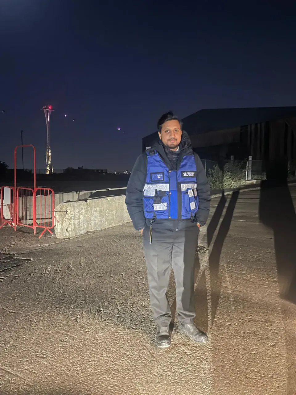 Zentinel security officer on night mobile patrol at a construction site perimeter